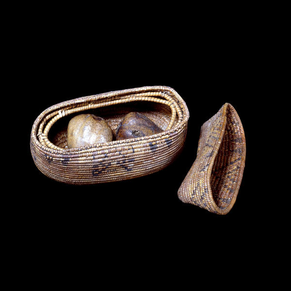 Lidded basket containing fruit